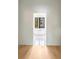 Elegant bathroom showcasing a modern soaking tub with a view to the property exterior at 115 Nova Ln, Roswell, GA 30075