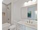 This bathroom features a tub and shower combination, a light countertop, and vanity with storage drawers at 115 Nova Ln, Roswell, GA 30075