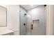 Bathroom with marble countertops, glass-enclosed shower, and black fixtures at 115 Nova Ln, Roswell, GA 30075