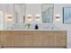Elegant bathroom features dual vanities, marble countertops, and stylish mirrors at 115 Nova Ln, Roswell, GA 30075