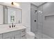 Modern bathroom featuring sleek vanity with stone countertop and a glass-enclosed shower at 115 Nova Ln, Roswell, GA 30075