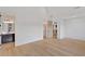 A bedroom featuring light hardwood floors, with an ensuite bathroom and walk-in closet for convenient living at 115 Nova Ln, Roswell, GA 30075