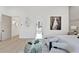 Staged bedroom featuring art, sitting area, and view of a bathroom at 115 Nova Ln, Roswell, GA 30075