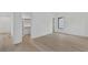 Bedroom with walk-in closet, ensuite door and large window providing natural light at 115 Nova Ln, Roswell, GA 30075