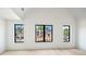 Spacious bedroom showcasing large windows with views of the home's exterior at 115 Nova Ln, Roswell, GA 30075
