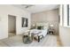 Stylishly furnished bedroom featuring a comfortable bed, seating, and elegant decor elements on light wood floors at 115 Nova Ln, Roswell, GA 30075