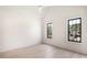 Bright, airy bedroom featuring neutral walls, hardwood flooring, and large windows at 115 Nova Ln, Roswell, GA 30075