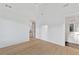 A spacious bedroom with light hardwood flooring, ensuite bathroom, and ample natural light for a comfortable retreat at 115 Nova Ln, Roswell, GA 30075