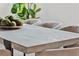 Close up view of the dining table with moss decorative balls in the center at 115 Nova Ln, Roswell, GA 30075