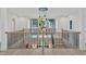 Spacious foyer with modern chandelier, staircase, and upper-level landing at 115 Nova Ln, Roswell, GA 30075