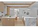Kitchen with stainless steel appliances, double islands, wooden beams, and pendant lighting at 115 Nova Ln, Roswell, GA 30075