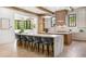 Spacious gourmet kitchen with an oversized island, modern pendant lights, and high-end appliances at 115 Nova Ln, Roswell, GA 30075