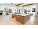 Bright open kitchen featuring double islands with marble countertops and modern lighting at 115 Nova Ln, Roswell, GA 30075