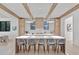 Wide angle of the kitchen, showing a large island with seating and wooden beams at 115 Nova Ln, Roswell, GA 30075