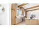 Modern kitchen featuring custom cabinets, a large center island, and sleek appliances at 115 Nova Ln, Roswell, GA 30075