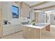 Kitchen with wooden island, stainless steel appliances, white backsplash, and pendant lighting at 115 Nova Ln, Roswell, GA 30075