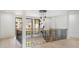 Upstairs landing features decorative chandelier and railing overlooking the staircase below at 115 Nova Ln, Roswell, GA 30075