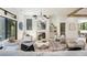 Bright living room features a modern fireplace, contemporary decor, and ample natural light at 115 Nova Ln, Roswell, GA 30075