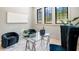 Bright office featuring a sleek glass desk, modern seating, and large windows at 115 Nova Ln, Roswell, GA 30075