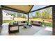 Covered outdoor patio with stylish furniture and a view of the backyard at 115 Nova Ln, Roswell, GA 30075
