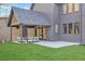 The backyard features a covered patio and outdoor seating area, perfect for outdoor entertaining and relaxation at 115 Nova Ln, Roswell, GA 30075