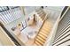 Open staircase with modern railing and decorative lighting features at 115 Nova Ln, Roswell, GA 30075
