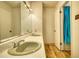 Functional bathroom with a dual sink vanity and laminate flooring at 177 Fairview Dr, Fairburn, GA 30213