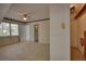 Neutral carpeted bedroom with windows and doors to other rooms at 177 Fairview Dr, Fairburn, GA 30213