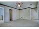 Neutral carpeted bedroom with doors to other rooms at 177 Fairview Dr, Fairburn, GA 30213
