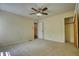 Spacious bedroom with neutral carpet, ceiling fan and ample natural light at 177 Fairview Dr, Fairburn, GA 30213