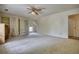 Open bedroom with plush carpet and custom shelving at 177 Fairview Dr, Fairburn, GA 30213