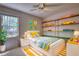 Cozy bedroom featuring playful decor, natural light, and stylish furnishings at 177 Fairview Dr, Fairburn, GA 30213