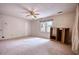 Bright bedroom with plush carpet, fan, and natural light at 177 Fairview Dr, Fairburn, GA 30213