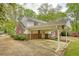 Exterior shot of a two-story home with brick and white siding and attached carport at 177 Fairview Dr, Fairburn, GA 30213