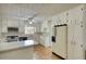 Updated kitchen featuring white cabinets, marble countertops and stainless steel appliances at 177 Fairview Dr, Fairburn, GA 30213