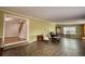 Inviting living room features unique flooring, traditional furniture, and access to staircase at 177 Fairview Dr, Fairburn, GA 30213