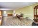 Open living room with stone-patterned flooring and a neutral color palette at 177 Fairview Dr, Fairburn, GA 30213