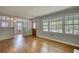 Open living room featuring hardwood floors, lots of natural light, and access to other living spaces at 177 Fairview Dr, Fairburn, GA 30213