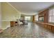 Spacious living room with a brick fireplace, built-in shelving, and large windows at 177 Fairview Dr, Fairburn, GA 30213