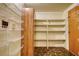 Walk-in pantry with shelves and cabinets for organized storage at 177 Fairview Dr, Fairburn, GA 30213