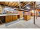 Unfinished basement features a workbench, shelving and visible utilities, awaiting your personalization at 4927 Bedell Ne Rd, Roswell, GA 30075