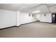 Large finished basement area with neutral carpeting and painted walls is ready for you to make it your own at 4927 Bedell Ne Rd, Roswell, GA 30075