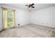Empty room with neutral carpet, and a window at 4927 Bedell Ne Rd, Roswell, GA 30075