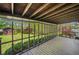 Screened in deck and view to a fenced in backyard and shed at 4927 Bedell Ne Rd, Roswell, GA 30075