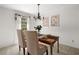 Bright dining room with classic chandelier and natural light at 4927 Bedell Ne Rd, Roswell, GA 30075