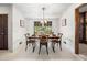 Bright dining room with a chandelier and a view of the backyard at 4927 Bedell Ne Rd, Roswell, GA 30075