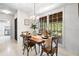 Dining room area with a view of the deck and backyard through a large window at 4927 Bedell Ne Rd, Roswell, GA 30075