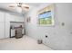 Versatile room with built-in desk, cabinets, and natural light from the window at 4927 Bedell Ne Rd, Roswell, GA 30075