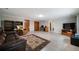 Spacious basement rec room with tile floors, entertainment center, and comfortable seating at 5839 Darry Cir, Norcross, GA 30093