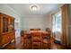 Cozy dining room with wood table and chairs, plenty of light from the window at 5839 Darry Cir, Norcross, GA 30093